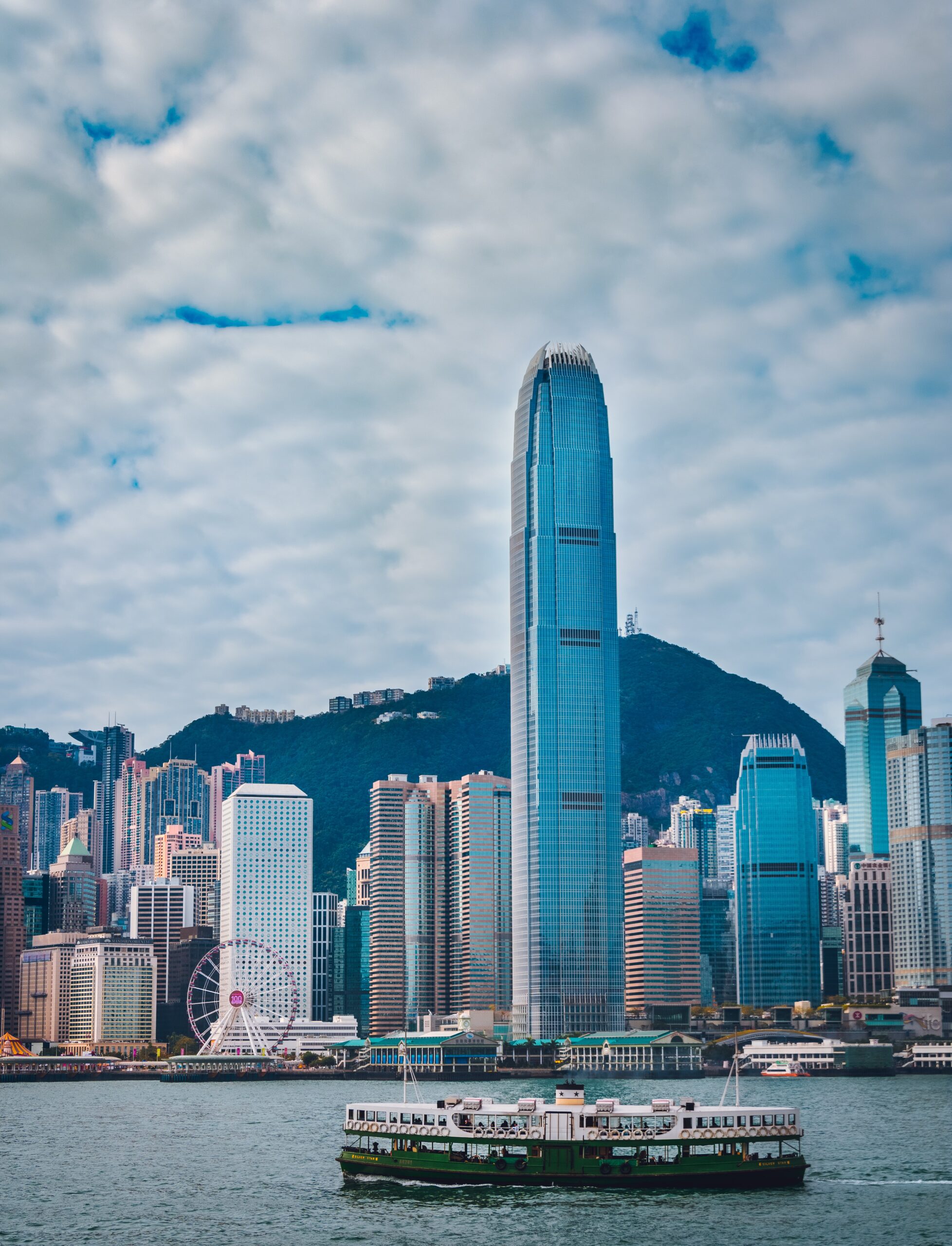 Hong Kong skyline with star ferry sailing during the day