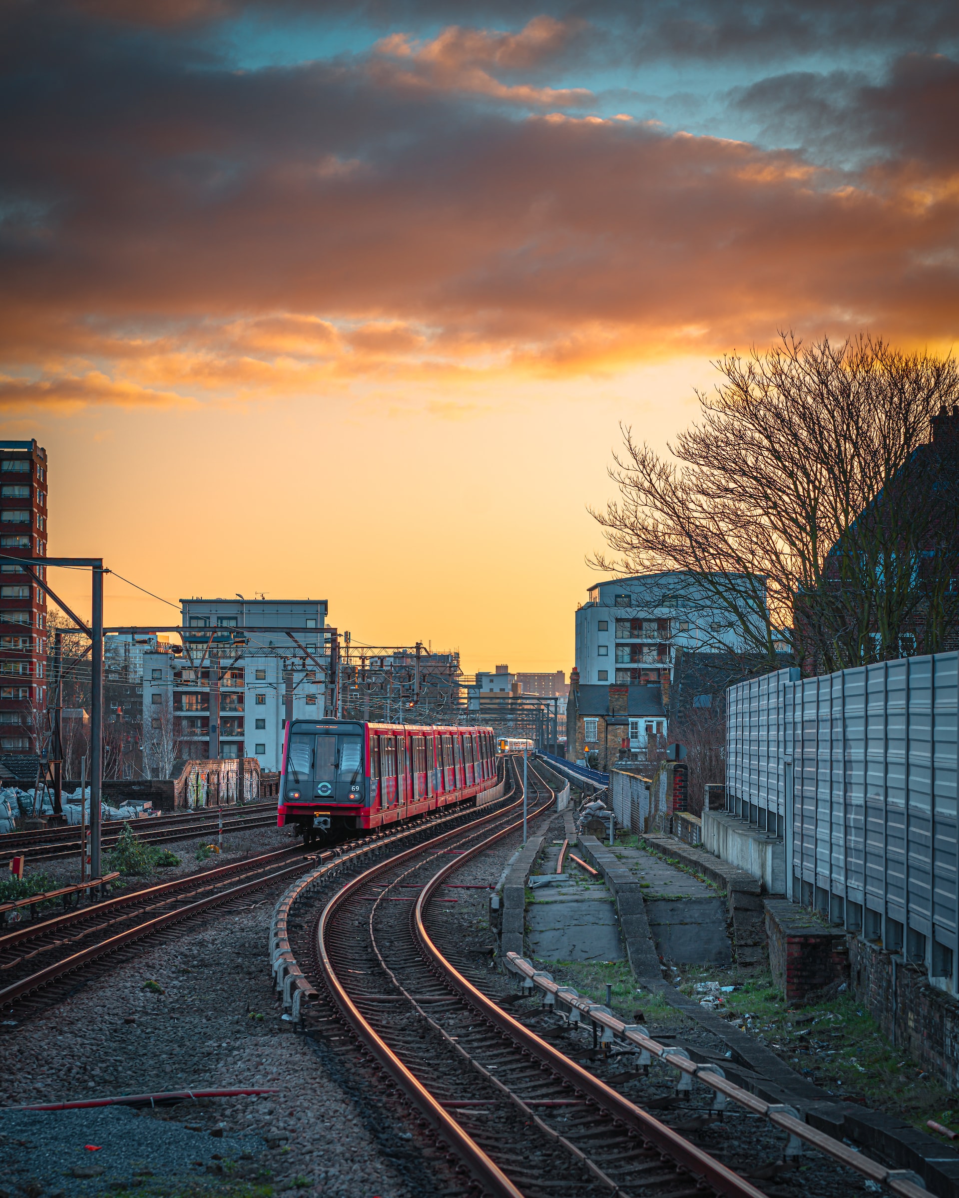 DLR train on tracks at sunset